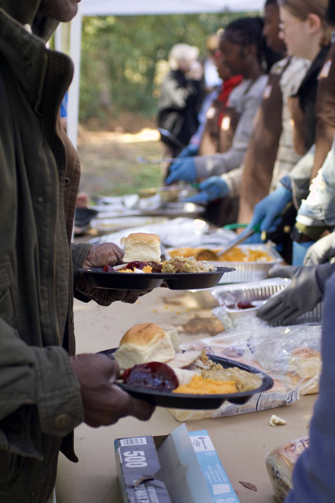 A plate of Thanksgiving food held at the One Table Florence serving line.